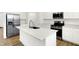 Well-lit kitchen featuring stainless steel appliances, quartz countertops, and a central island with a sink at 2004 Foothill Dr, Greenfield, IN 46140