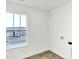 Laundry room featuring a window with neighborhood views, white trim, and hookups ready for appliances at 2004 Foothill Dr, Greenfield, IN 46140