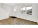 Bright living room with laminate flooring, white walls, a view of the front door and large windows providing ample natural light at 2004 Foothill Dr, Greenfield, IN 46140
