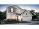 Charming two-story home featuring a two-car garage, landscaped yard, and a mix of siding and brick accents at 2134 Boxwood Dr, Greenfield, IN 46140