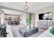 Bright living room showcasing modern furniture and an open concept kitchen and dining area at 2134 Boxwood Dr, Greenfield, IN 46140