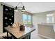 Bright loft with a large window, chalkboard wall, and a table with craft supplies at 2134 Boxwood Dr, Greenfield, IN 46140