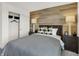 Inviting bedroom features a wood accent wall, comfortable furnishings, and spacious closet at 2152 Boxwood Dr, Greenfield, IN 46140