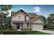 New two-story home with a mix of board and batten and shake siding and a front-facing two car garage at 2152 Boxwood Dr, Greenfield, IN 46140