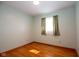 Cozy bedroom with natural light from a window and classic wood flooring at 2566 S Ritter Ave, Indianapolis, IN 46203
