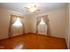 Light-filled bedroom featuring gleaming hardwood floors and light colored walls at 2566 S Ritter Ave, Indianapolis, IN 46203