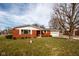 Charming brick ranch home featuring an attached garage and well-maintained front yard at 2566 S Ritter Ave, Indianapolis, IN 46203