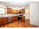 Spacious kitchen boasts stainless steel appliances, wood cabinets, and sleek countertops at 2566 S Ritter Ave, Indianapolis, IN 46203