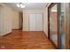 Bright living space featuring hardwood floors, large closet, and sliding door to patio at 2566 S Ritter Ave, Indianapolis, IN 46203