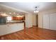 Open-concept living and kitchen area with hardwood floors and plenty of natural light at 2566 S Ritter Ave, Indianapolis, IN 46203