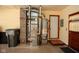 Utility room displaying a modern furnace, water heater, and convenient access to an exterior door at 2566 S Ritter Ave, Indianapolis, IN 46203