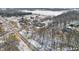 Aerial shot of several homes on a wooded lot in a rural neighborhood in winter at 2843 E 236Th St, Cicero, IN 46034