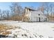 Rustic barn in a snowy field, showcasing its weathered charm at 2843 E 236Th St, Cicero, IN 46034