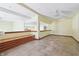 Open basement area with tile flooring, custom bench and unique lighting at 2843 E 236Th St, Cicero, IN 46034