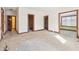Bedroom with three doorways and natural light, featuring unfinished flooring at 2843 E 236Th St, Cicero, IN 46034