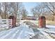 Long driveway leading to a home in a wooded lot with brick entrance pillars at 2843 E 236Th St, Cicero, IN 46034