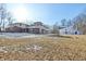 Property featuring a house and barn on a snow-covered lot at 2843 E 236Th St, Cicero, IN 46034