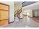 Foyer with a staircase, tile flooring, and an open view of the living area at 2843 E 236Th St, Cicero, IN 46034