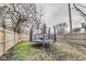 Fenced backyard featuring trampoline and space to relax and enjoy outdoor activities at 2962 Station St, Indianapolis, IN 46218