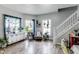 Inviting living room boasts hardwood floors, lots of natural light and charming decor at 2962 Station St, Indianapolis, IN 46218