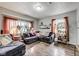 Cozy living room with ample natural light, modern furniture, and hardwood flooring at 2962 Station St, Indianapolis, IN 46218