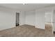 Neutral carpeted bedroom with white trim, featuring a connected bathroom and closet or adjoining bedroom at 2996 Grand Ridge Dr, Greenwood, IN 46143