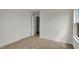 View of a well-lit bedroom with neutral carpet and white trim at 2996 Grand Ridge Dr, Greenwood, IN 46143