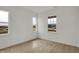 Neutral carpeted bedroom with white walls and trim features dual view windows and ample natural light at 2996 Grand Ridge Dr, Greenwood, IN 46143