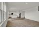 Open floor plan featuring a kitchen with an island and modern appliances at 2996 Grand Ridge Dr, Greenwood, IN 46143