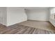 Spacious living room showcasing an open floor plan with wood flooring and natural light at 2996 Grand Ridge Dr, Greenwood, IN 46143