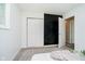 Minimalist bedroom with carpet, closet, and view of an adjacent room at 3549 Woodale Rd, Indianapolis, IN 46234