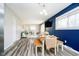 Open dining room with table and bench seating, seamlessly transitions to the living area at 3549 Woodale Rd, Indianapolis, IN 46234