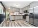 The kitchen features stainless steel appliances and ample cabinet space at 3549 Woodale Rd, Indianapolis, IN 46234