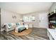 Bright living room features stylish decor and hardwood floors at 3549 Woodale Rd, Indianapolis, IN 46234
