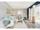 Cozy living room with comfortable sofa, stylish decor, and sliding glass door to the backyard at 3549 Woodale Rd, Indianapolis, IN 46234