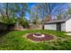 Backyard with a fire pit and a shed at 3944 Strathmore Dr, Indianapolis, IN 46235