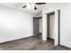 This bedroom features a gray door, a closet, and laminate floors at 3944 Strathmore Dr, Indianapolis, IN 46235