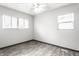 Well-lit bedroom with multiple windows and contemporary flooring and finishes at 3944 Strathmore Dr, Indianapolis, IN 46235