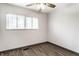 Bright bedroom with modern flooring, neutral finishes, and a large window at 3944 Strathmore Dr, Indianapolis, IN 46235