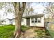 Charming single-story home featuring a secure front door and well-maintained lawn at 3944 Strathmore Dr, Indianapolis, IN 46235