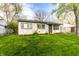 Cozy one-story house with a well-kept green lawn and inviting curb appeal at 3944 Strathmore Dr, Indianapolis, IN 46235