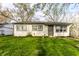 Attractive single-Gathering home showcasing a tidy front lawn and secure entrance at 3944 Strathmore Dr, Indianapolis, IN 46235