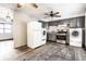 Spacious kitchen featuring grey cabinets, stainless steel appliances, washer, and dryer at 3944 Strathmore Dr, Indianapolis, IN 46235