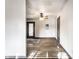 Well-lit living space featuring new flooring, a modern ceiling fan, and rear glass door at 3944 Strathmore Dr, Indianapolis, IN 46235
