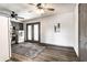 Contemporary living room with vinyl floors, laundry area, modern appliances and rear exit at 3944 Strathmore Dr, Indianapolis, IN 46235