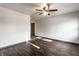 Open-concept living area with vinyl floors, a ceiling fan, and modern lighting fixtures at 3944 Strathmore Dr, Indianapolis, IN 46235