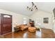 Cozy living room with hardwood floors, a modern light fixture and classic furniture at 401 W Westfield Blvd, Indianapolis, IN 46208