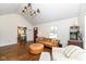 Inviting living room featuring hardwood floors, modern lighting, and a comfortable leather couch at 401 W Westfield Blvd, Indianapolis, IN 46208