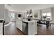 A bright, modern kitchen with a large island, stainless steel appliances, and an adjacent dining area at 4040 Jacoby Pl, Indianapolis, IN 46268