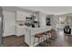 Well-lit kitchen featuring a large island with seating, modern appliances, and ample counter space at 4040 Jacoby Pl, Indianapolis, IN 46268